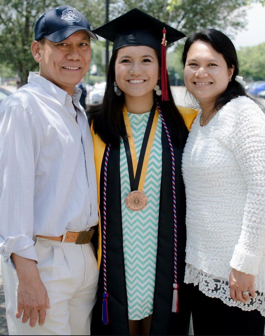 Maria celebrating her graduation with her family